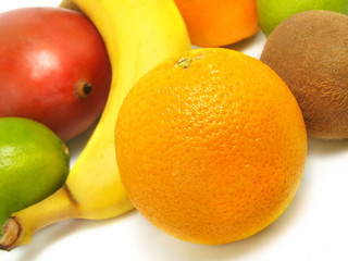 Ripe oranges, banana, mango, kiwi, limes