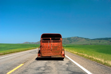 Antique pick up truck on empty picturesque Montana road, USA