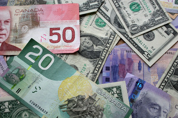 Fototapeta na wymiar US and canadian dollars