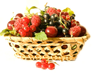 Basket with berries on a white background