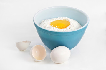 bowl filled with flour and eggs