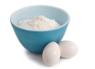 bowl filled with flour and eggs
