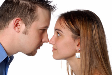 Man and woman nose to nose discussing business