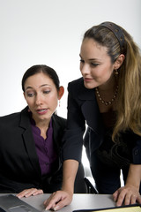 brunette women working in business suit at office
