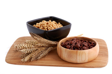 Two colors cereals with decoration on the white background