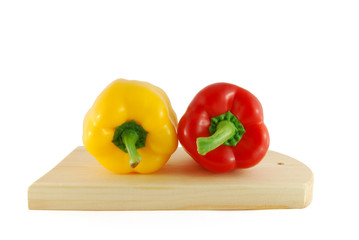 Two peppers on the board