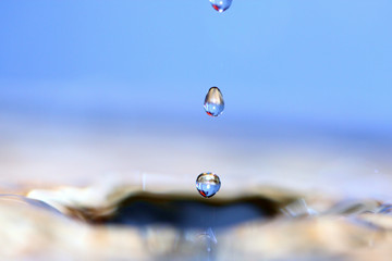 Water drop. Soft colors. Close-up.