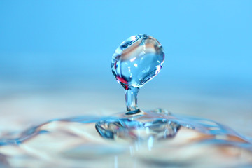 Water drop. Soft colors. Close-up.