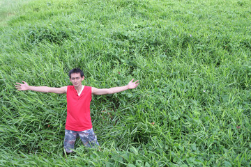 man in green field