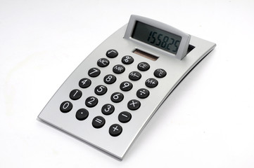 An electronic calculator on white