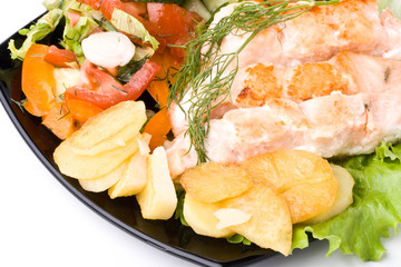 Stake from a salmon with vegetables