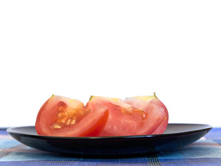 tomato slices at plate against the white background