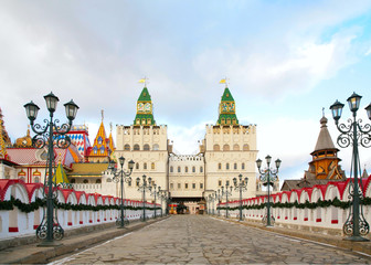 Fototapeta na wymiar Two towers, to them bridge road with lanterns in izmajlovo