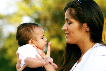 Mother Talking to her Baby Son Infant Boy