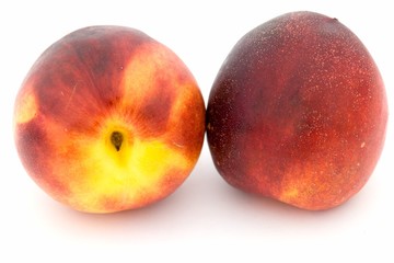 Two ripe nectarines