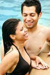 Fototapeta premium Young Couple Talking in a Swimming Pool