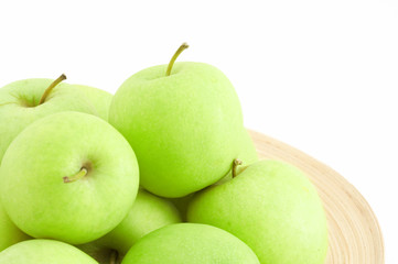 stack of apples on wooden plate