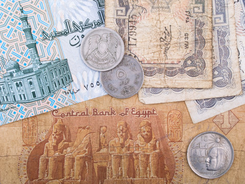 Old Egyptian banknotes and coins