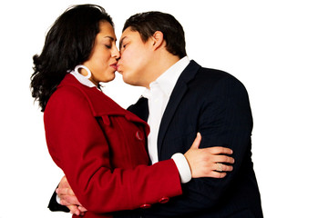 Young Hispanic Couple Kissing Isolated