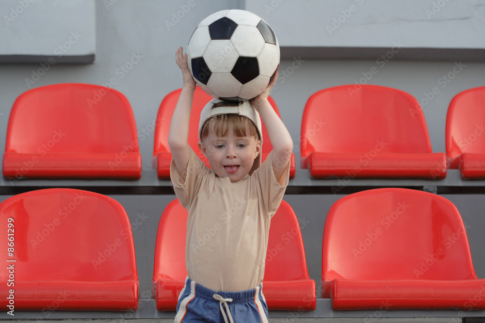 Wall mural The boy with a ba