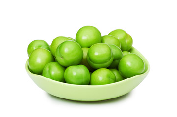 Green plums isolated on the white background