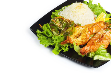 Grilled lobster, rice and vegetables isolated on white