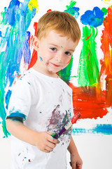 Child painting with a great expression