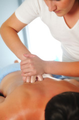 Fototapeta na wymiar back massage at the spa and wellness center