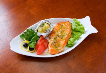 Stake from a salmon with vegetables