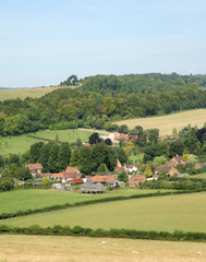 Fototapeta na wymiar An English Summer Landscape with a Village in the Valley