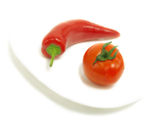 Hot chili pepper and fresh tomato