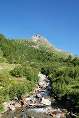 High mountain scene, river, blue sky, Switzerland, Ticino