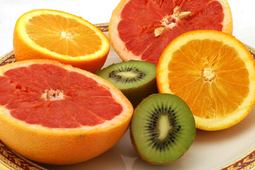 Fototapeta na wymiar half orange pomelo and kiwi