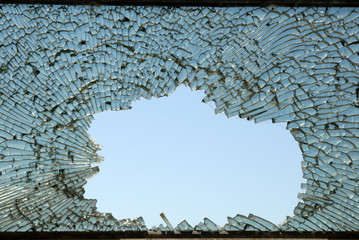 Crushed blue toned glass closeup