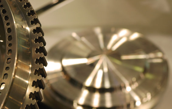 metallic background representing precision manufacturing