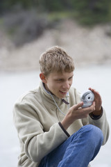 teenage boy taking photos