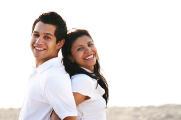 Portrait of Couple Smiling & Enjoying Summer