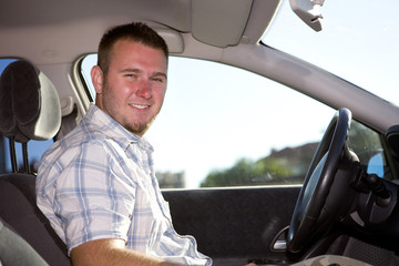 man in car