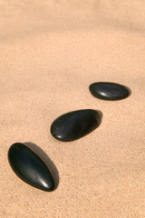 Fototapeta na wymiar Thre pebbles on the sand