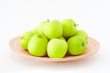 stack of apples on wooden plate