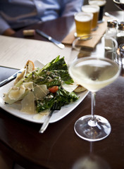 Appetizer salad and white wine
