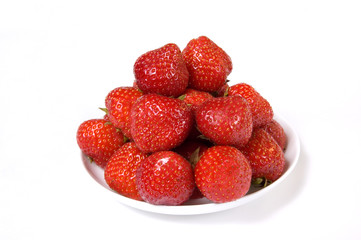 Fresh and tasty strawberries in a plate, isolated on white