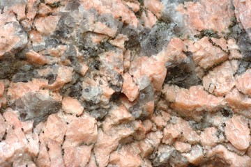 Texture of stone consisting of white and pink quartz