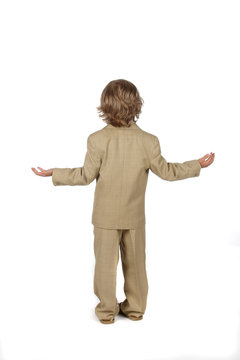 young boy in suit with arms out