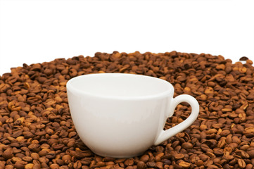 Cup and coffee beans isolated on the white