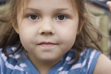 potrait of a little girl wearing a striped t-shirt