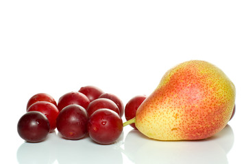 Yellow-red pear and some cherry plums isolated on the white