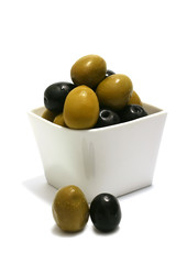 green and black olives inside white bowl