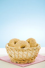 Fototapeta na wymiar Breakfast bagels on the kitchen table over blue background