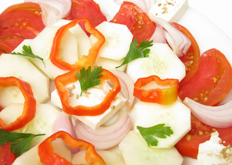 Greek salad with feta, onion, sesame, parsley and bell peppers